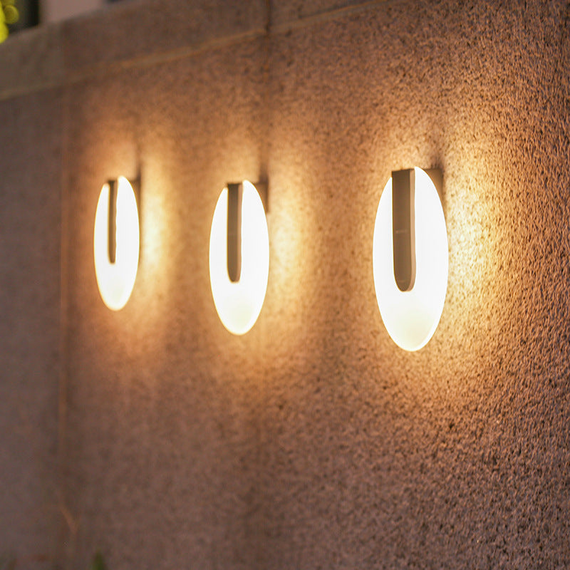 Waterproof Solar Outdoor Yard wall lights illuminating a textured surface, providing outdoor lighting.